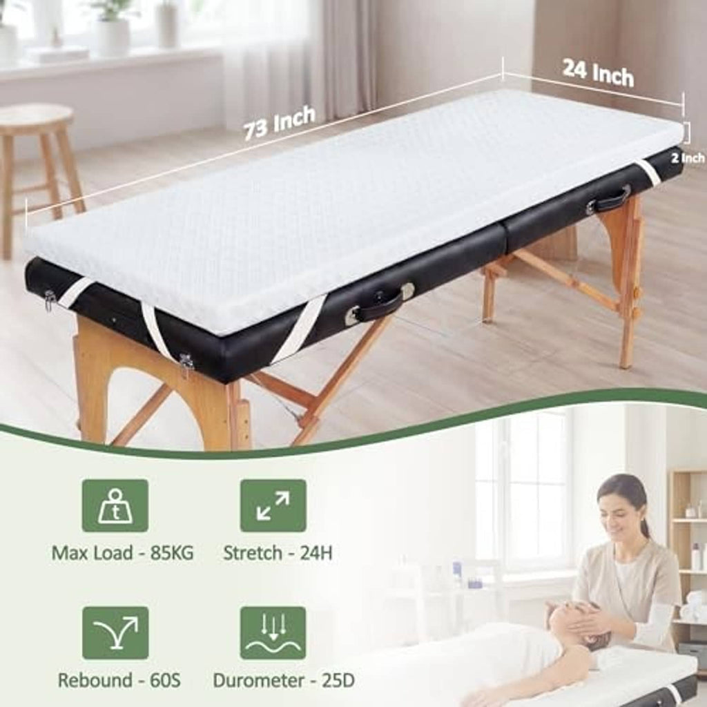 White memory foam massage table topper on black base with wooden legs