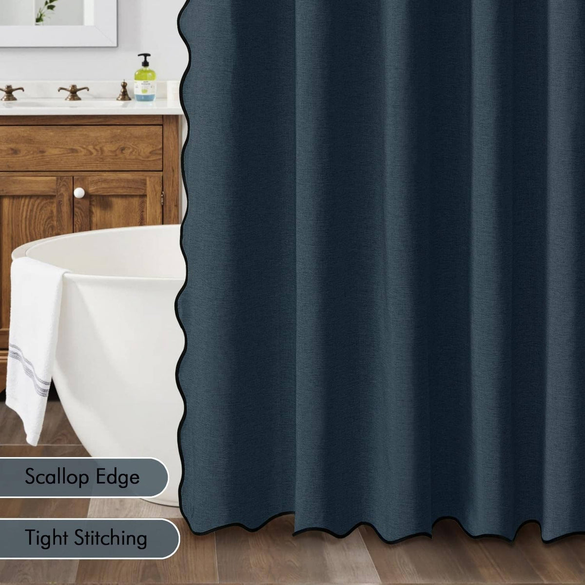 Navy blue shower curtain with scalloped edge hem and tight stitched seam detail.