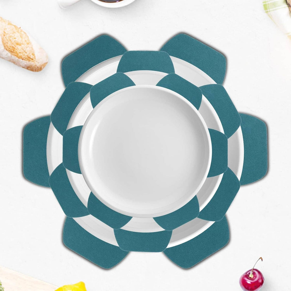 Teal felt protector pad mat under a white bowl, flower-shaped design