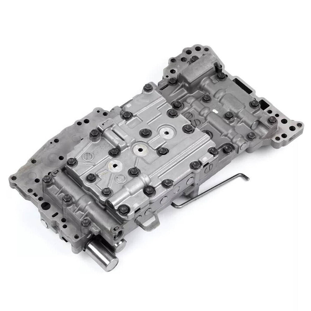 Transmission valve body with solenoids, top view of silver-gray metal valve plate