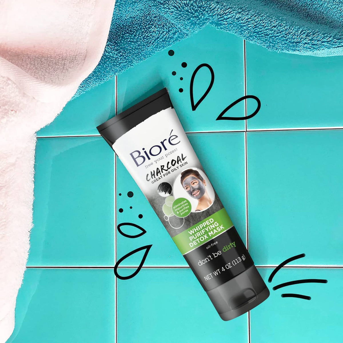 Biore charcoal whipped detox mask tube on bathroom tiles, close-up branding