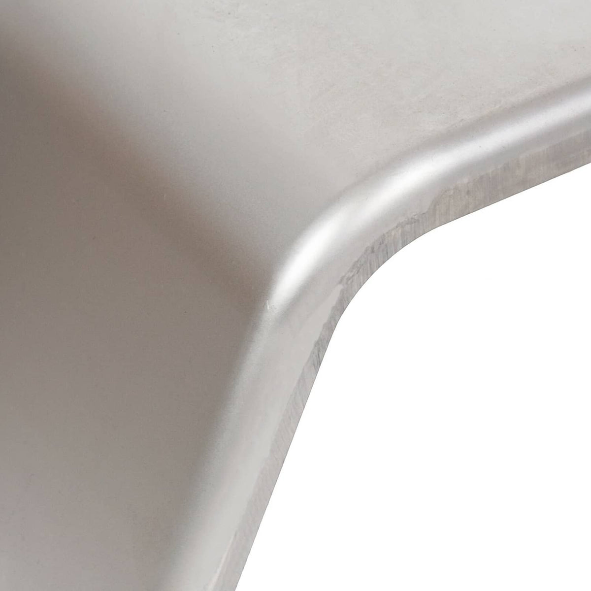 Close-up of light gray metal trailer fender curved outer edge