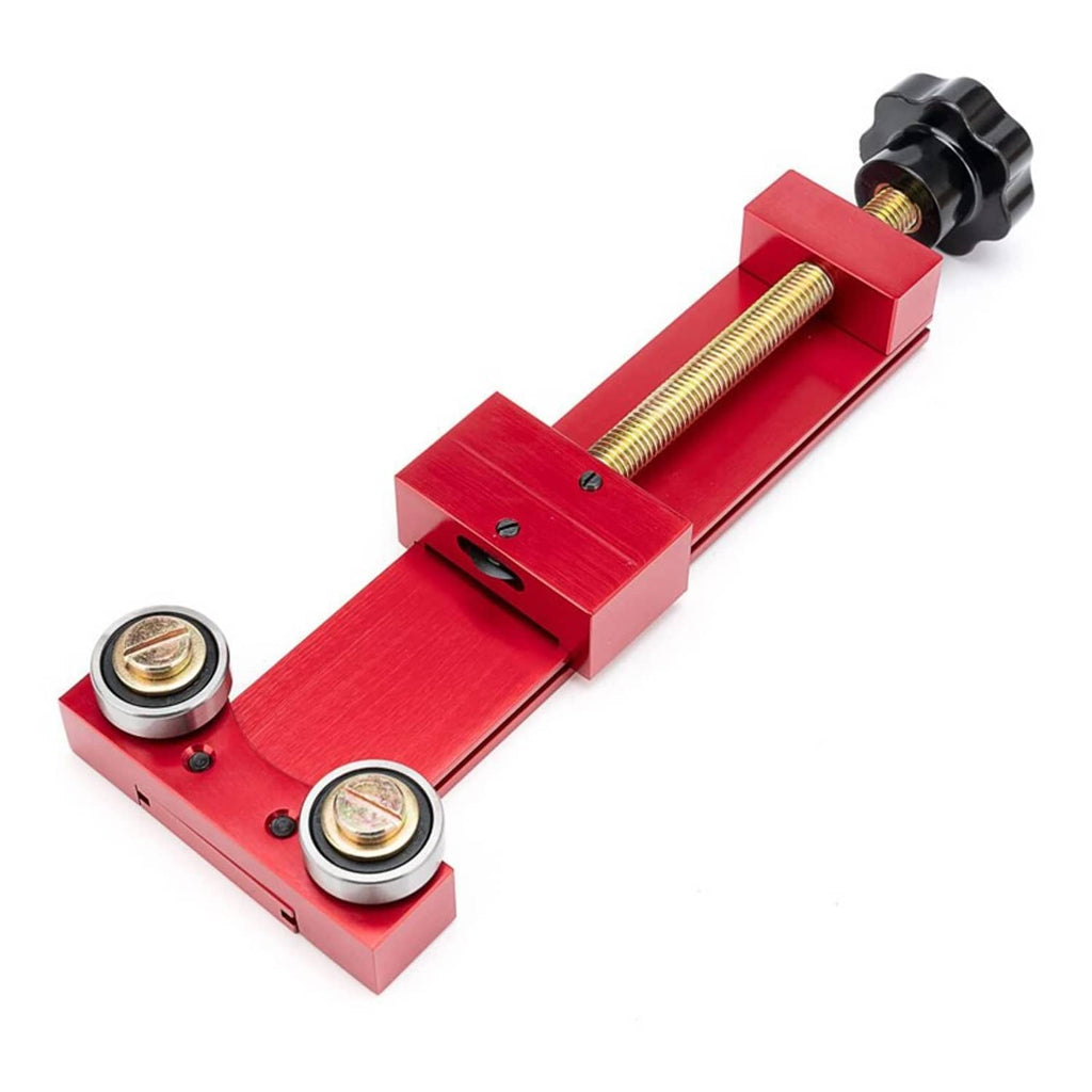Red oil filter cutter tool with two roller bearings and threaded screw on base frame
