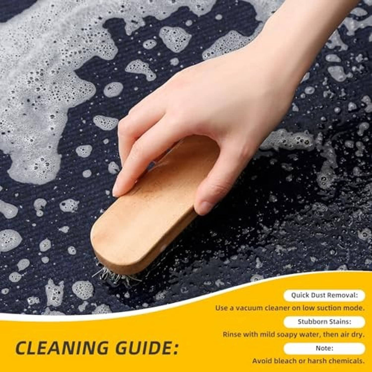 Blue oil change mat with orange area being scrubbed by hand with a brush
