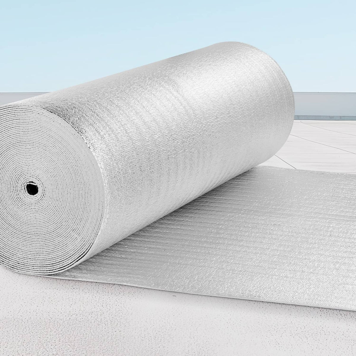 Rolled reflective insulation barrier with textured silver foil surface