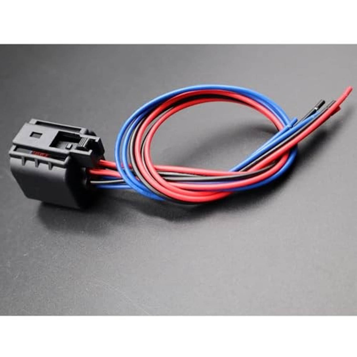 Headlamp connector plug with bundled red, blue, and black wires