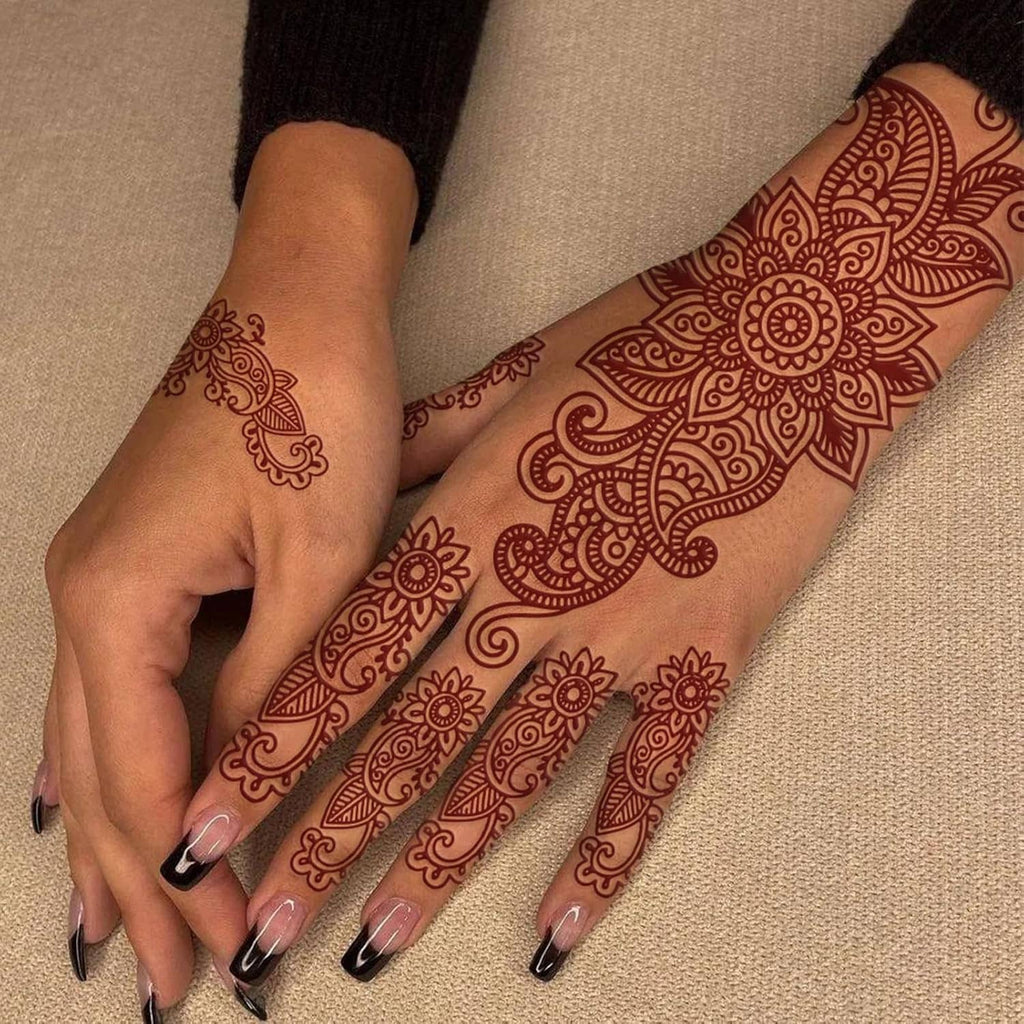 Brown henna-style fake tattoo on hands with ornate floral paisley pattern