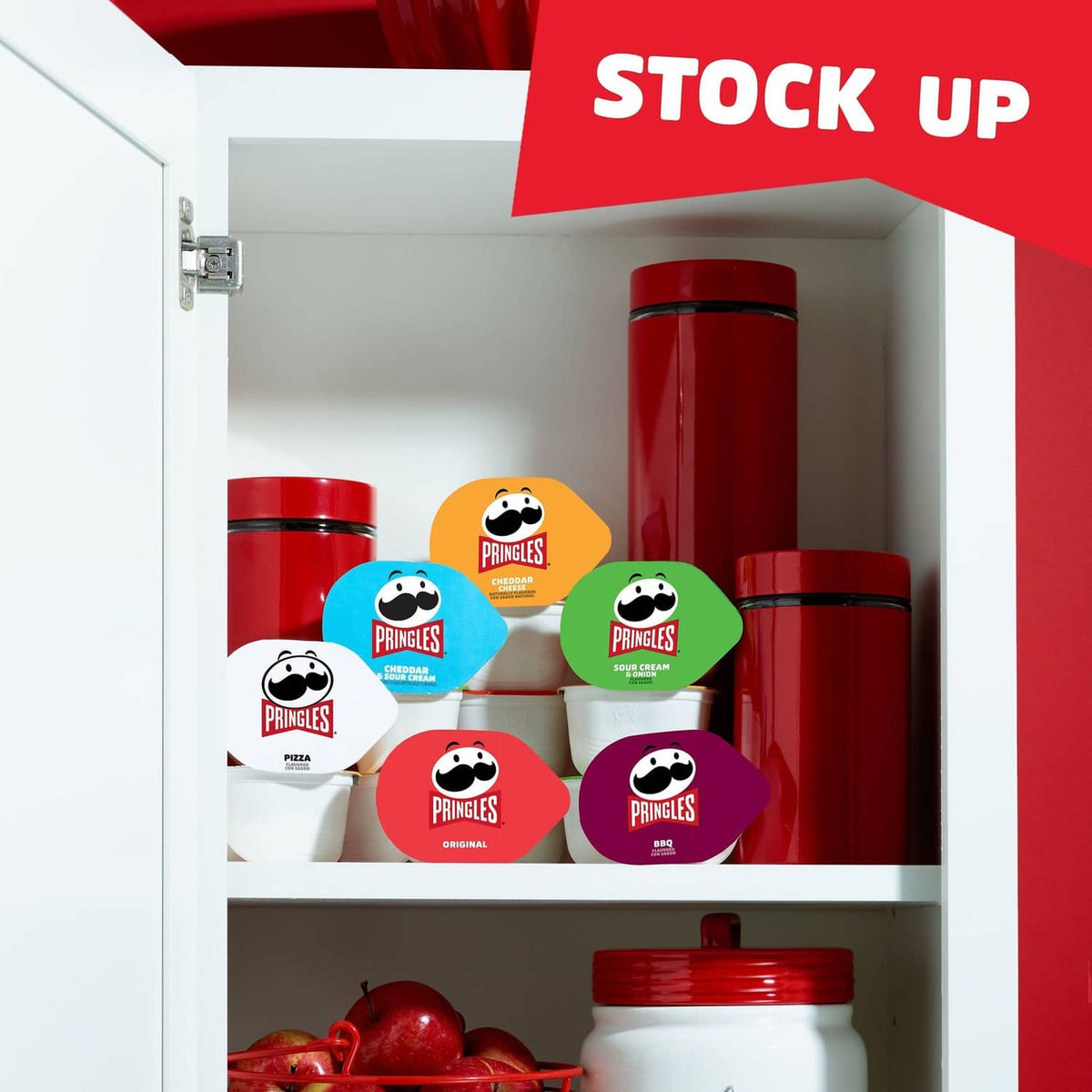 Pringles Snack Stacks display inside a white cabinet with multiple flavor cups
