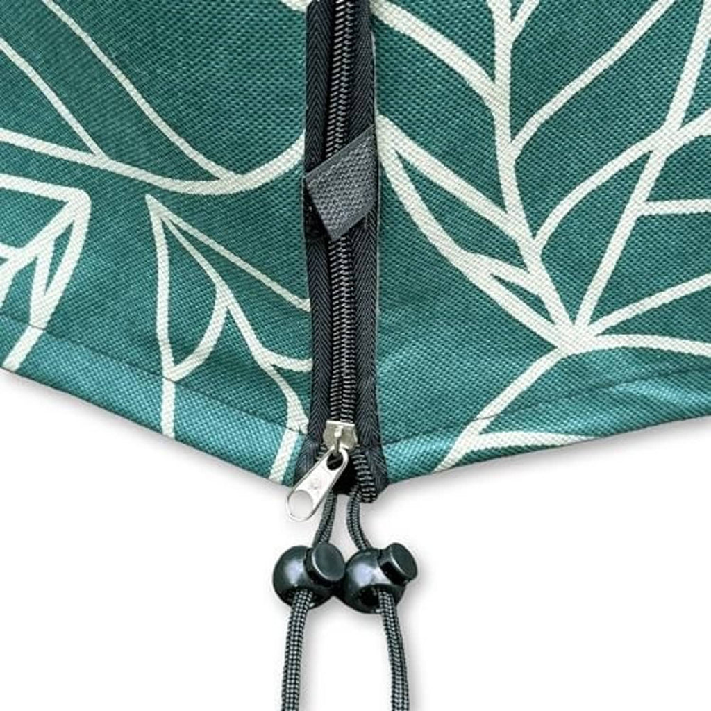 Close-up of green leaf-pattern cover zipper and drawstring cord