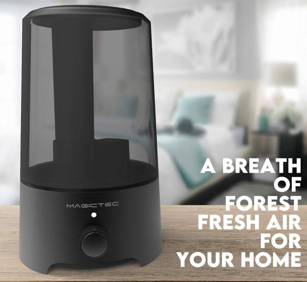 Black cool mist humidifier on countertop with visible mist outlet