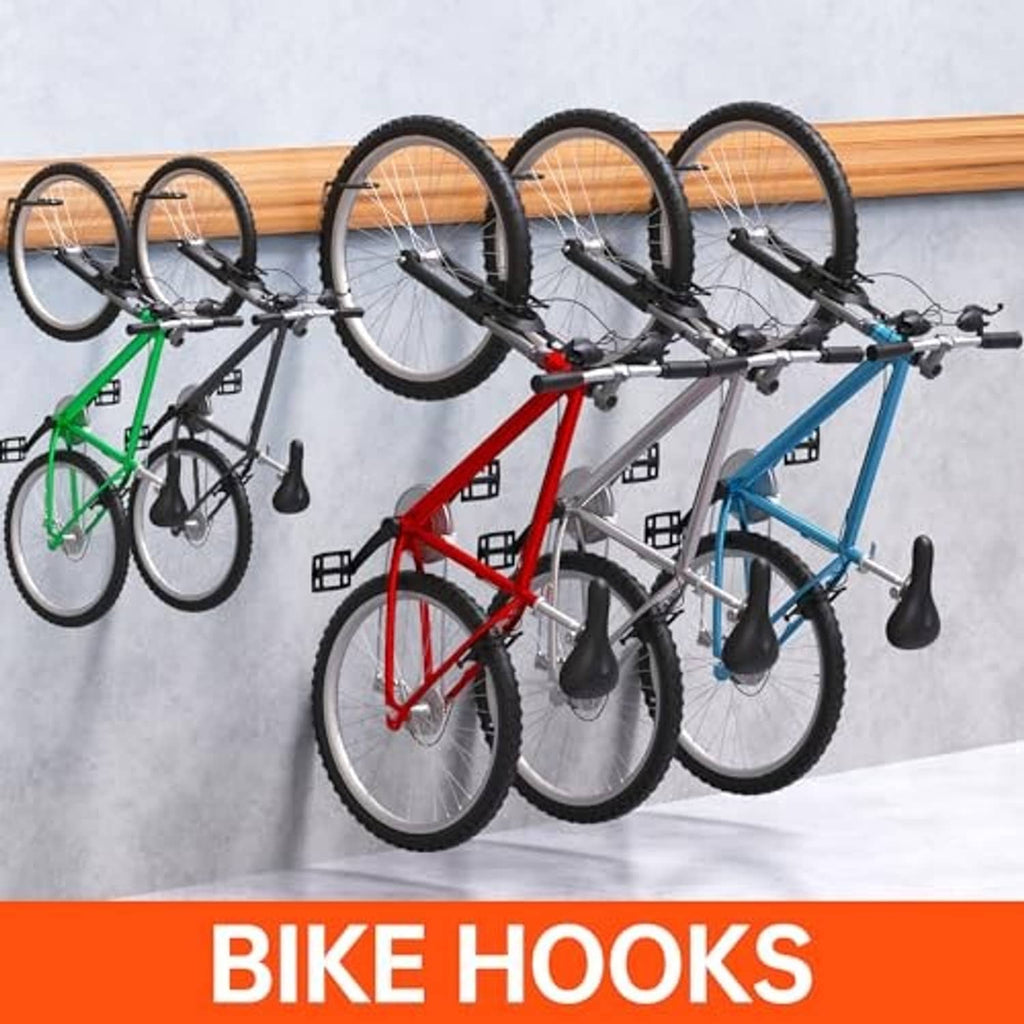 Wall-mounted black bike hooks holding multiple bicycles from a wooden rail.