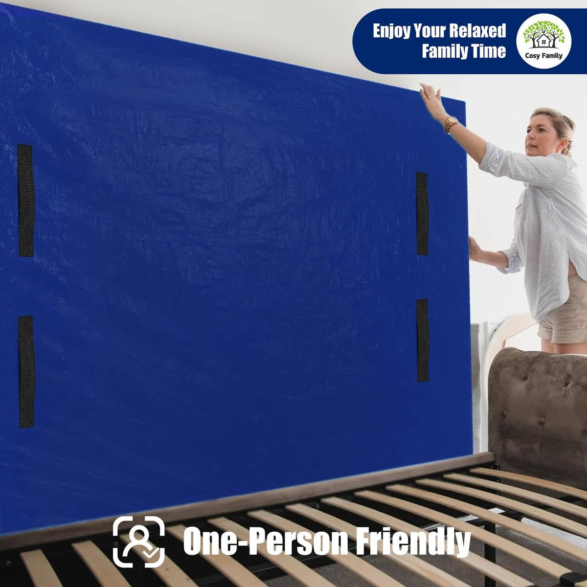 Blue mattress moving bag with black handle loops, held upright