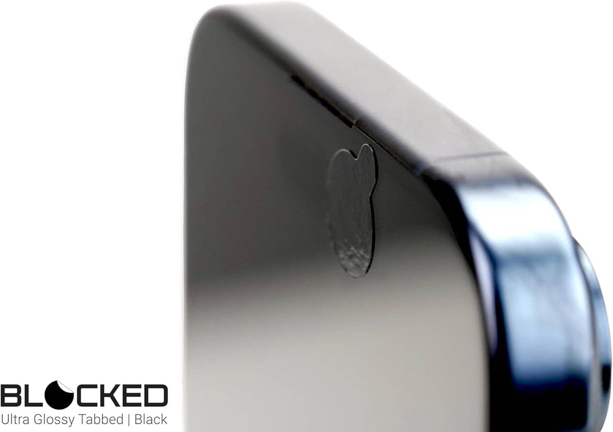 Black glossy webcam cover sticker covering a webcam lens on the device edge