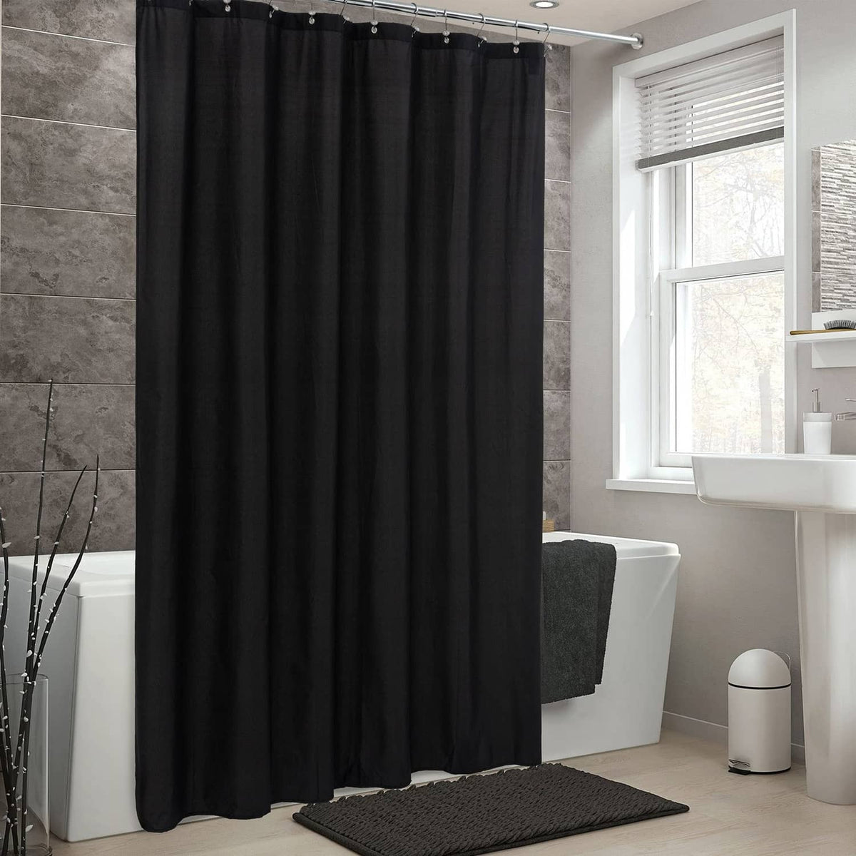 Black waterproof shower curtain with buttonhole top and full hanging drape