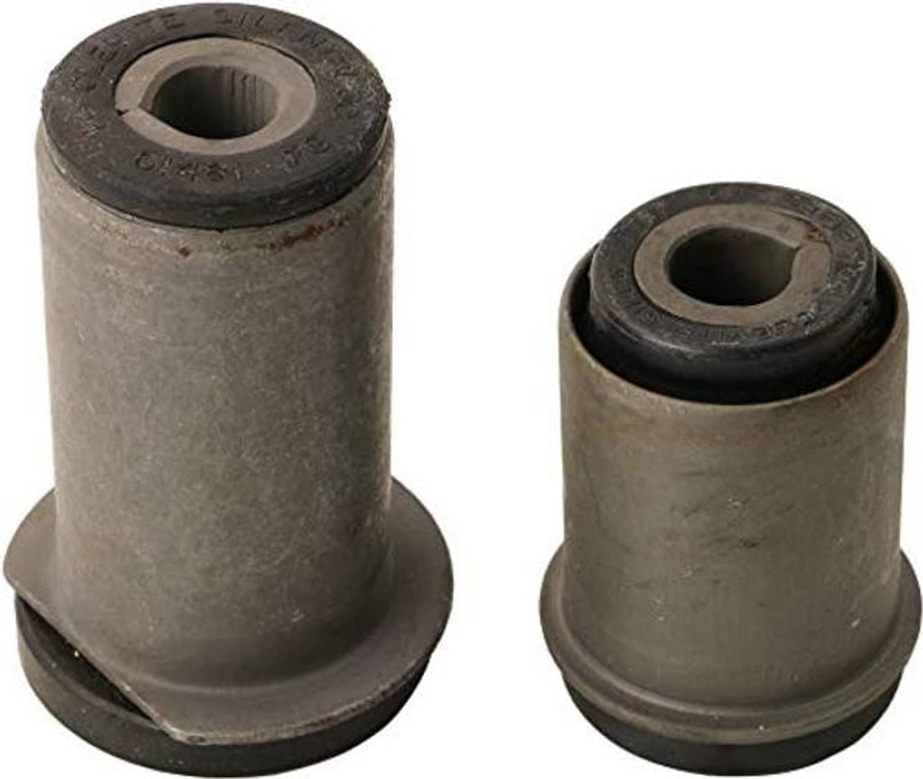 Two suspension bushing components with black rubber inner sleeve and metal housing