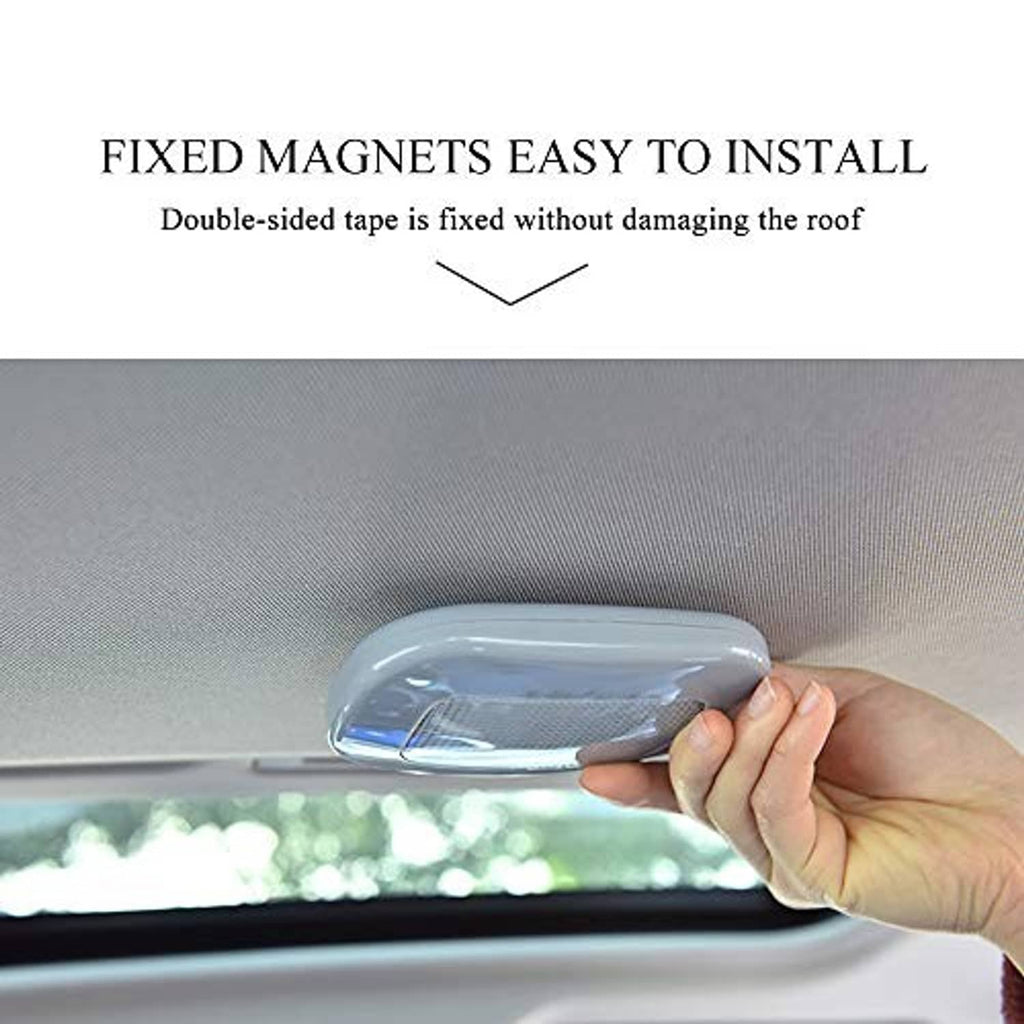White car dome reading light held in hand, shown for roof mounting