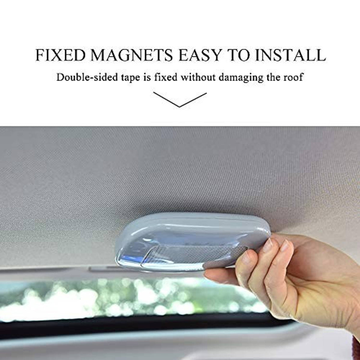 White car dome reading light held in hand, shown for roof mounting