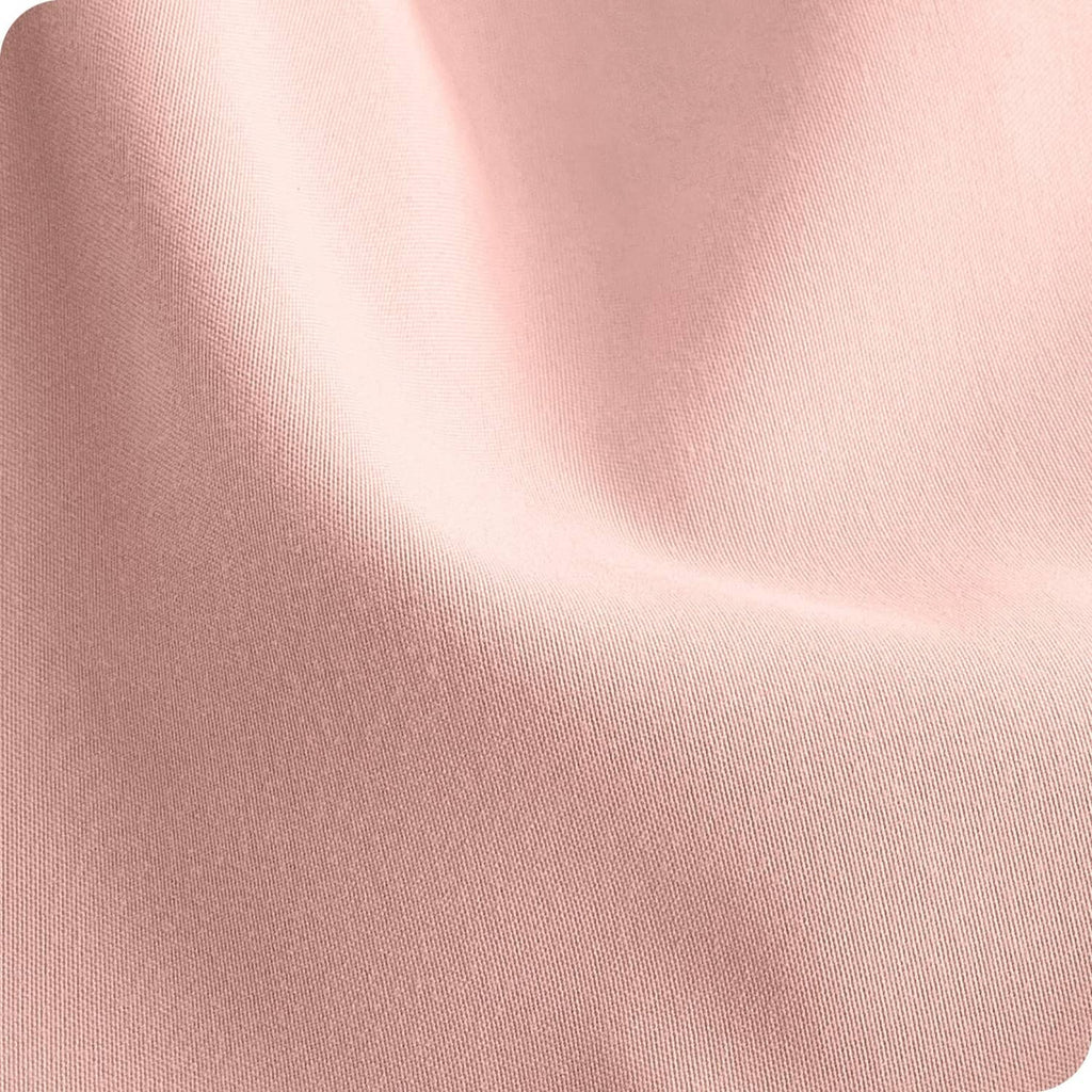 Pink microfiber fitted sheet fabric close-up with fine woven texture and soft sheen