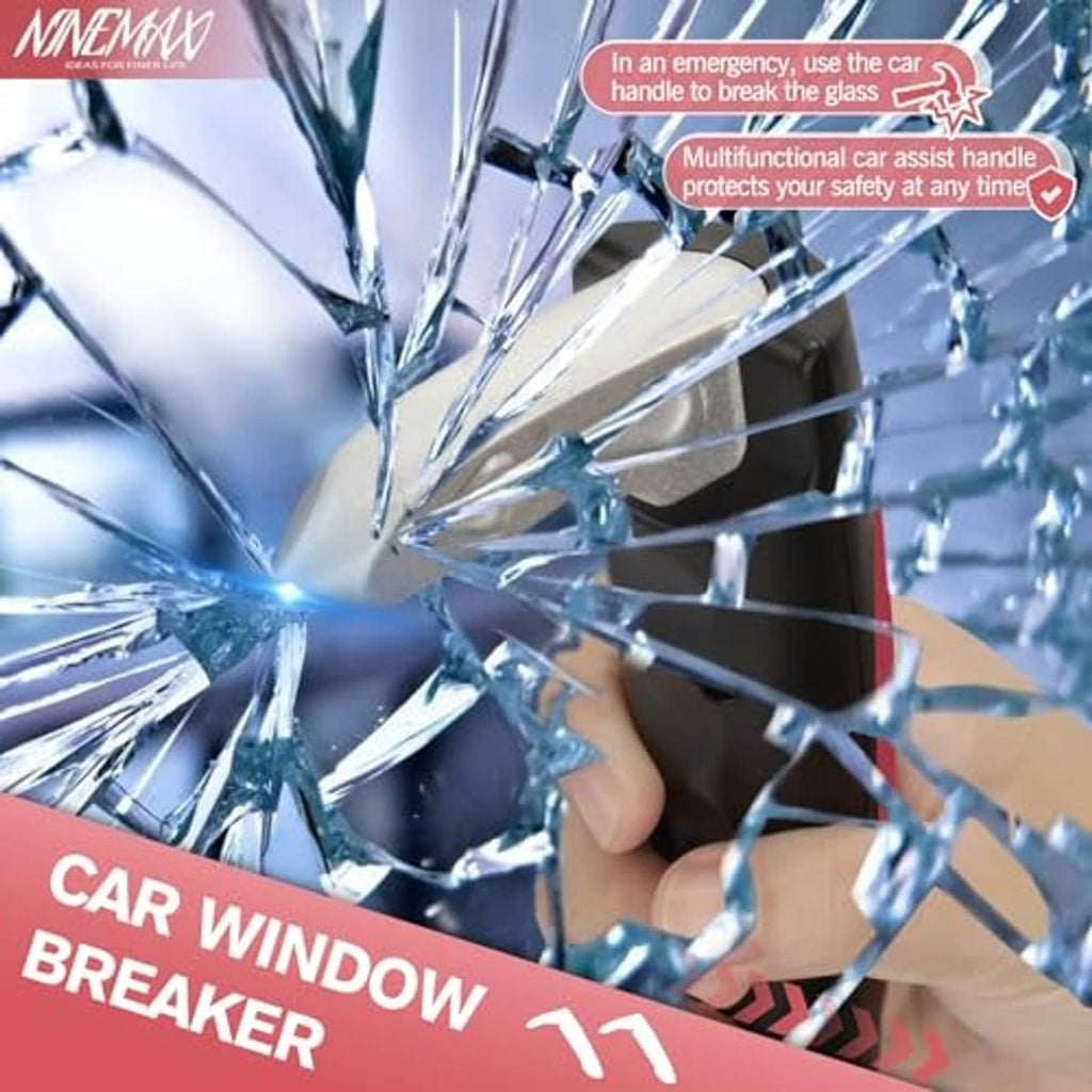 Red and black car door assist handle shown near broken window glass for emergency use