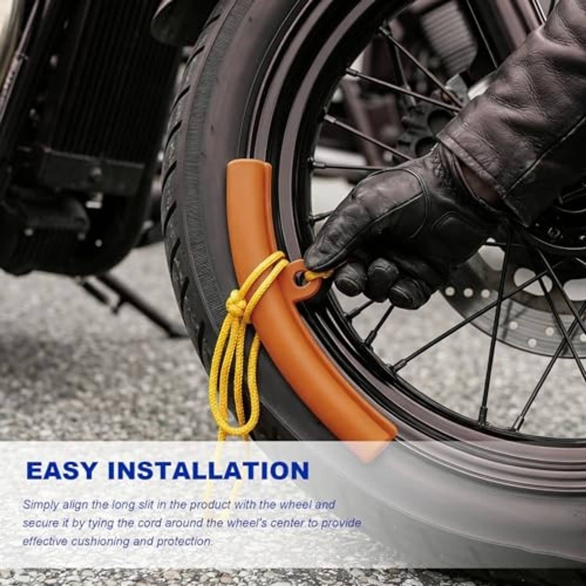 Orange wheel rim protector installed on a tire rim with yellow cord