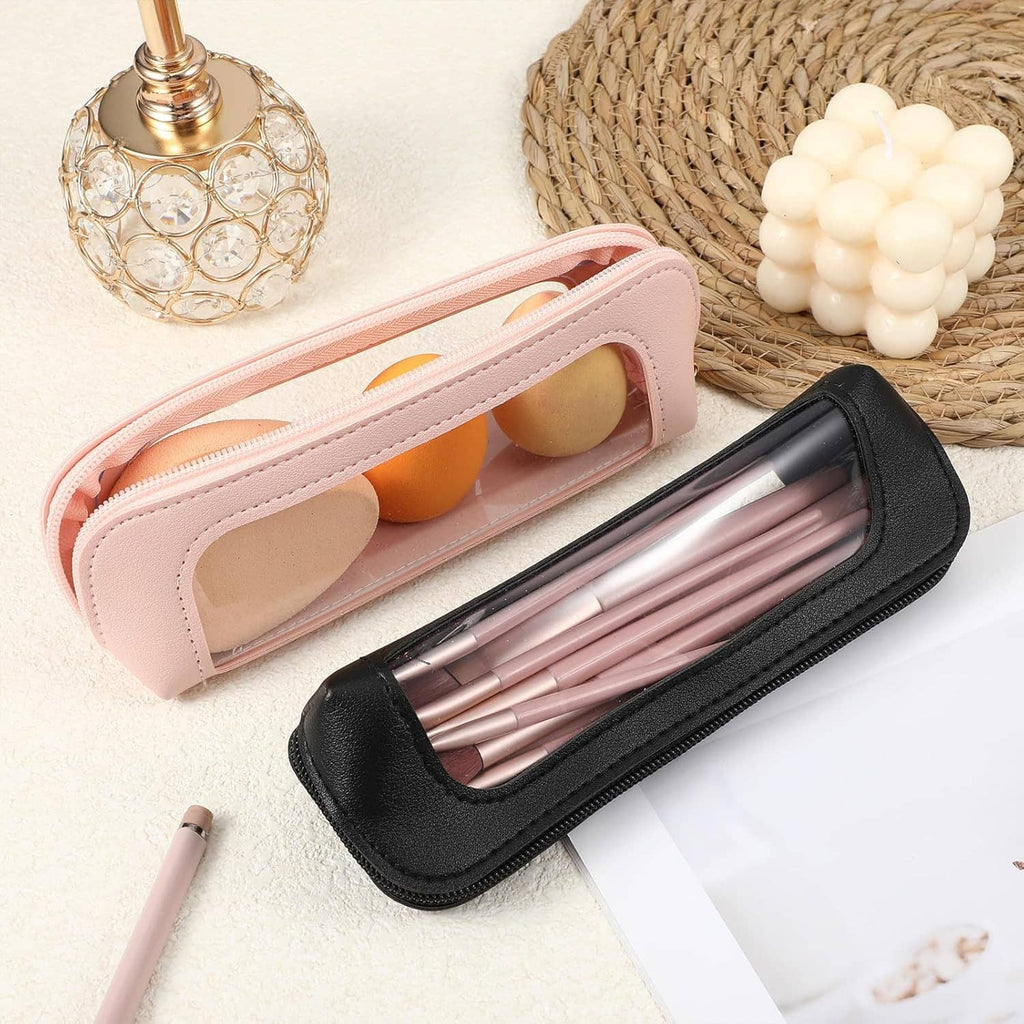 Pink and black clear makeup brush bags with transparent windows, brushes visible inside