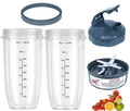 Set of clear 32oz blender cups with dark lid, blade and spacer ring
