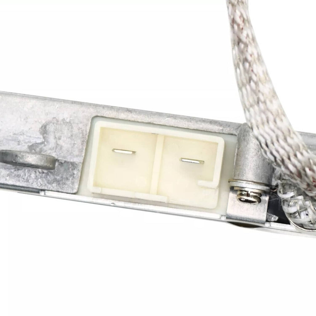 Close-up of HID ballast mounting bracket with connector and safety label