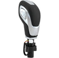 Automatic transmission shift knob with black leather-texture grip and silver control panel