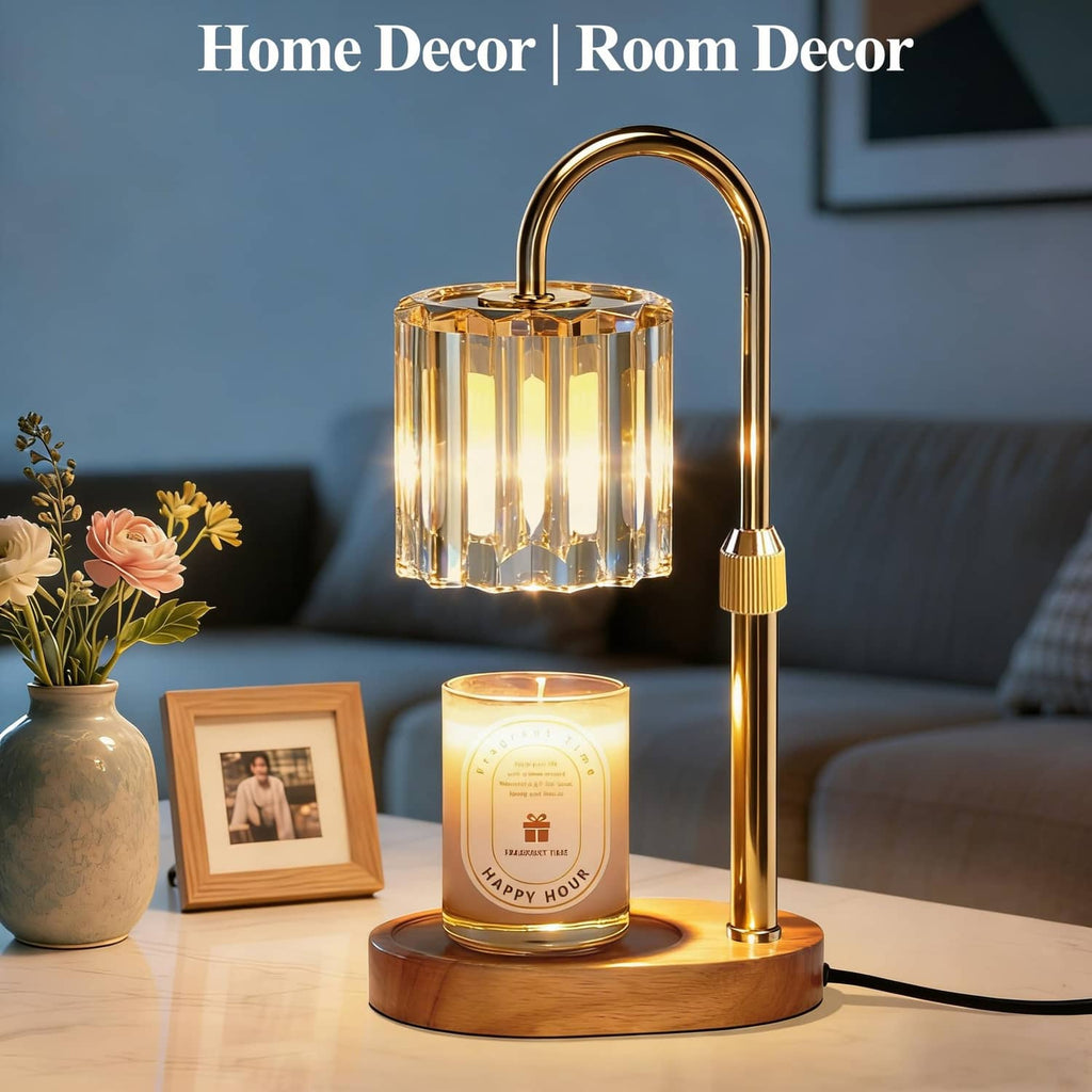 Candle warmer lamp with curved gold frame, clear glass cylinder, and lit amber candle