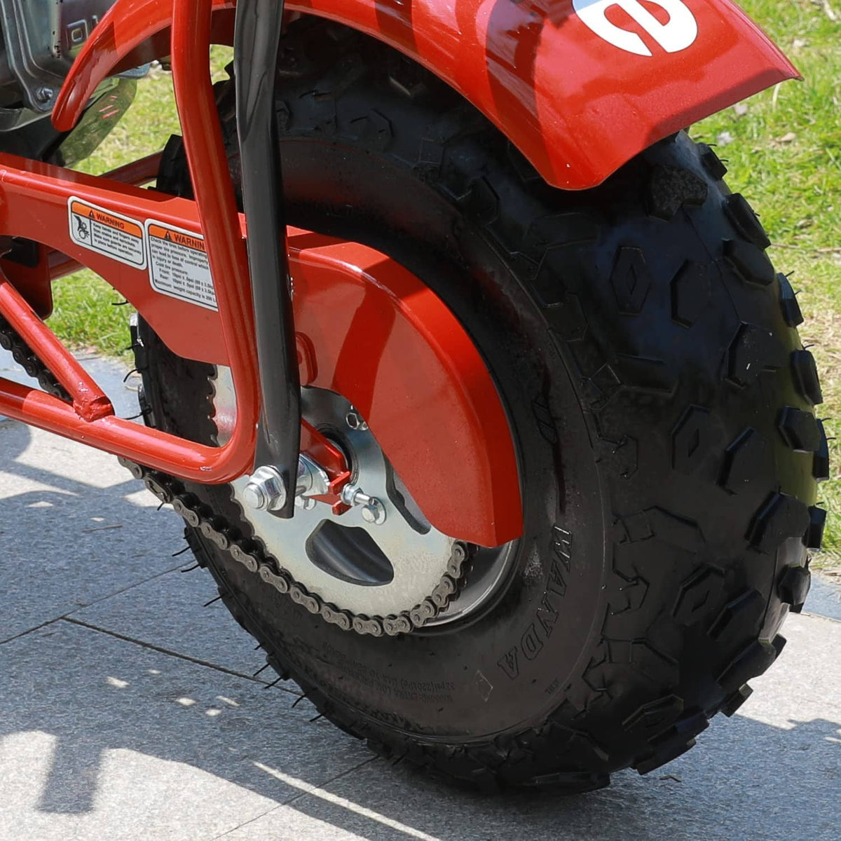 Quad bike drive sprocket with 420 chain and toothed gear near the rear wheel