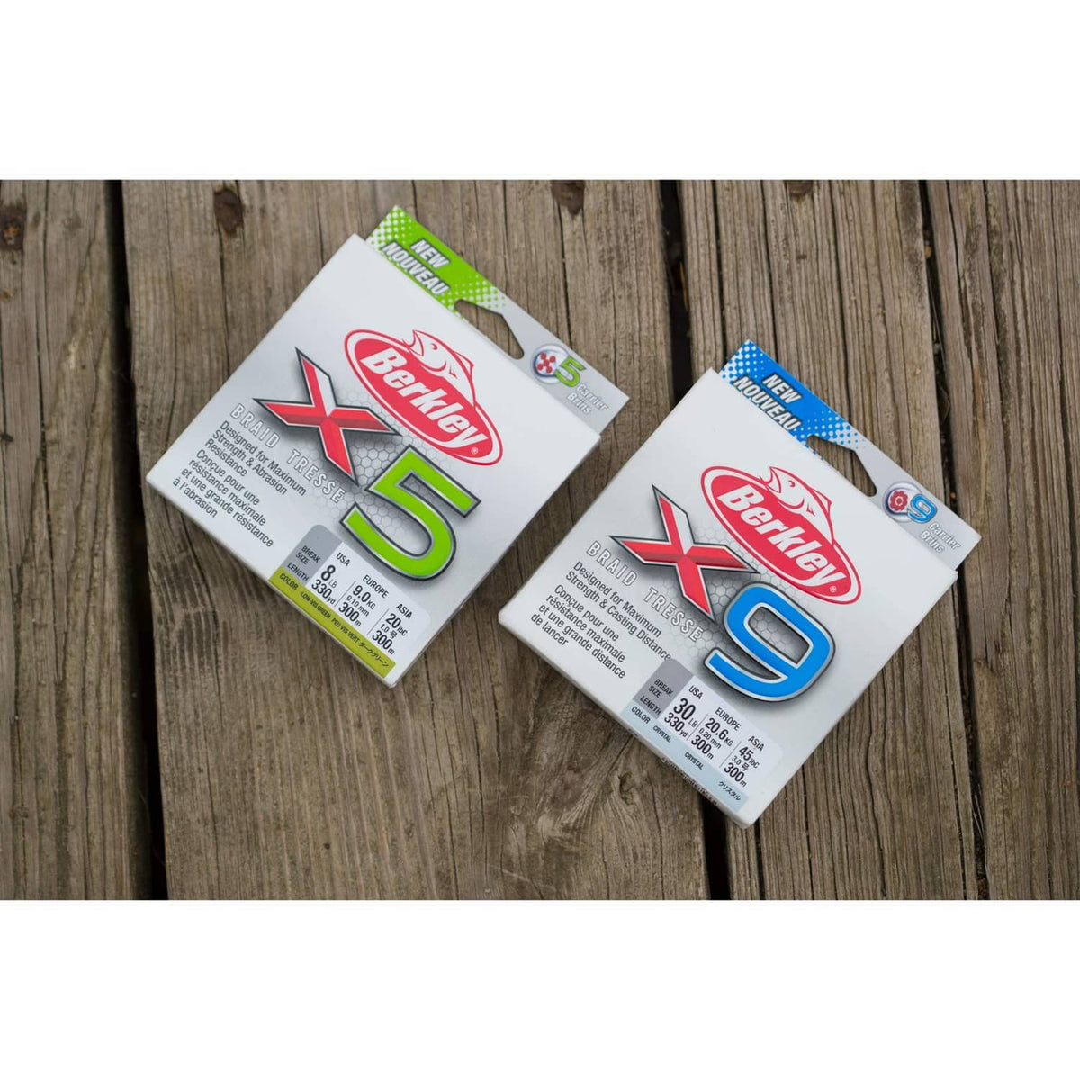Berkley X5 and X9 braided fishing line boxes on wooden dock planks