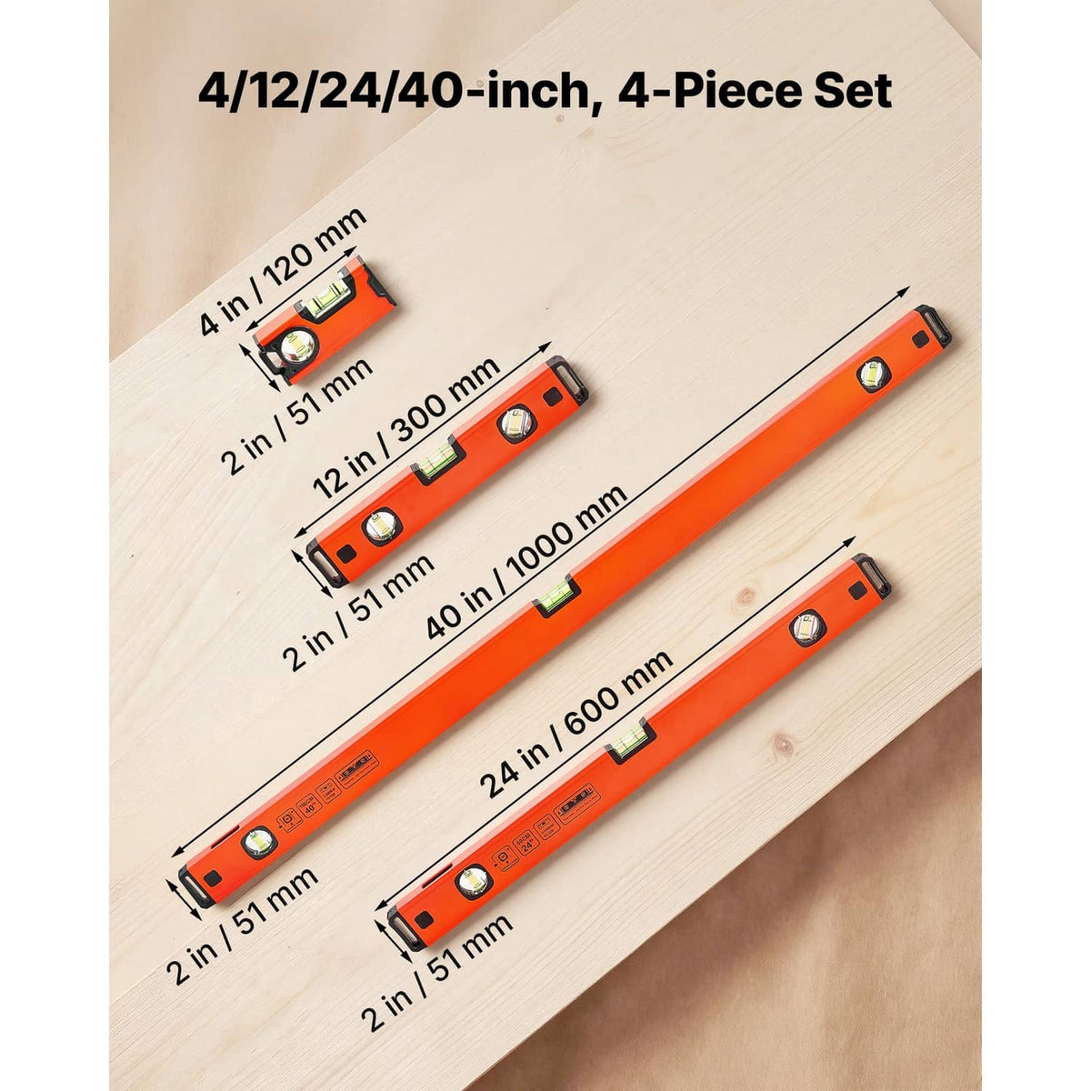 Four-piece orange torpedo level set laid on wood, showing multiple lengths and vial windows