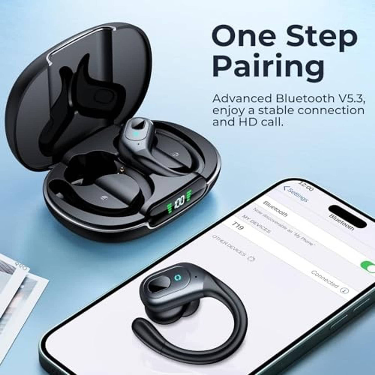 Matte black wireless earbuds with charging case beside a smartphone