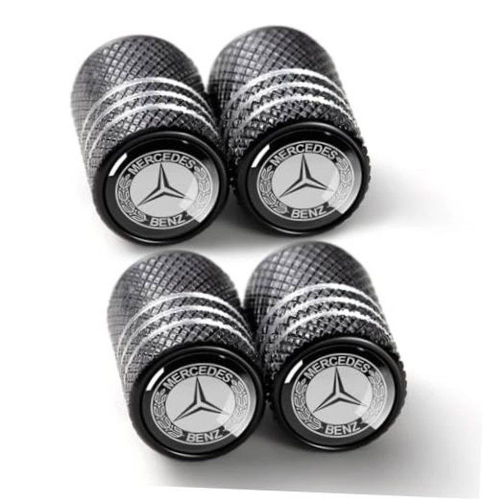 Set of black tire valve stem caps with Mercedes-Benz emblem and textured grip