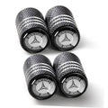 Set of black tire valve stem caps with Mercedes-Benz emblem and textured grip