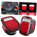 Pair of square rear tail lights with red lenses and clear LED strip tops