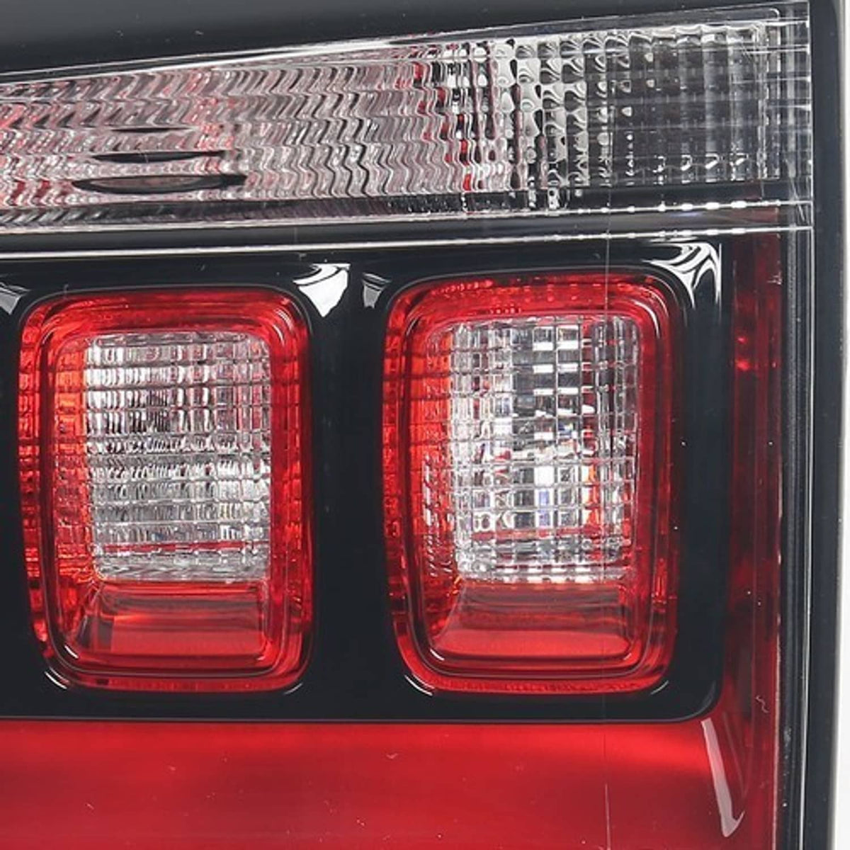 Right inner halogen tail light close-up, two red square lenses with clear reflector