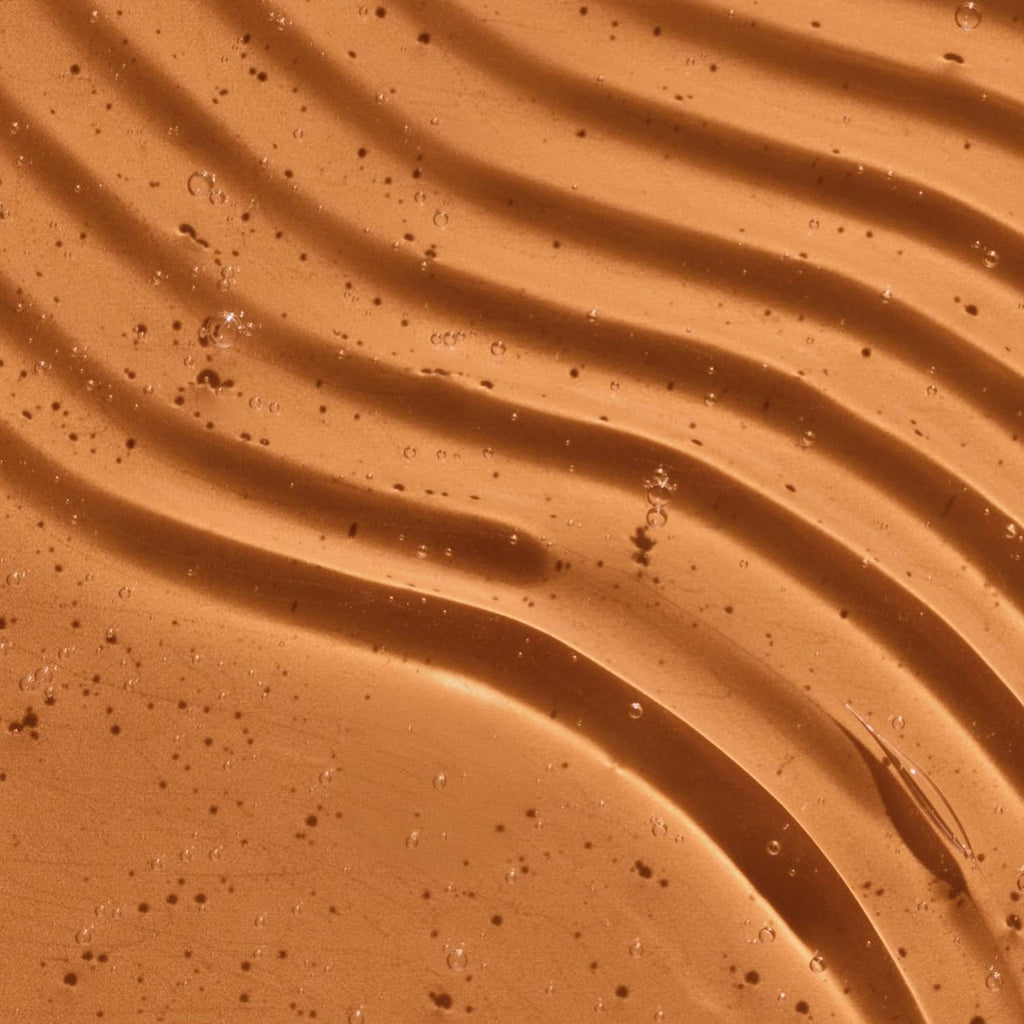 Thick orange gel with water droplets, smooth texture close-up