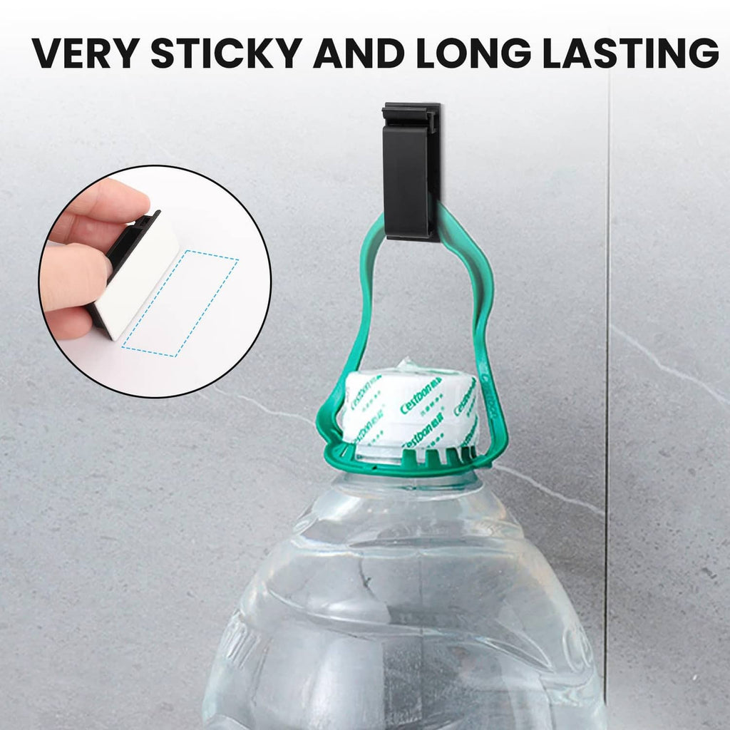 Black adhesive cable clip press-mounted to a surface
