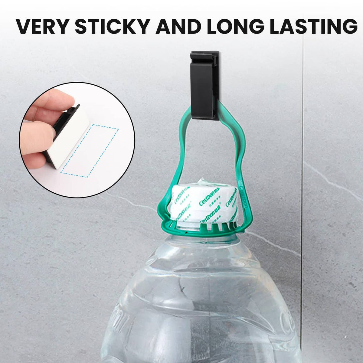 Black adhesive cable clip press-mounted to a surface