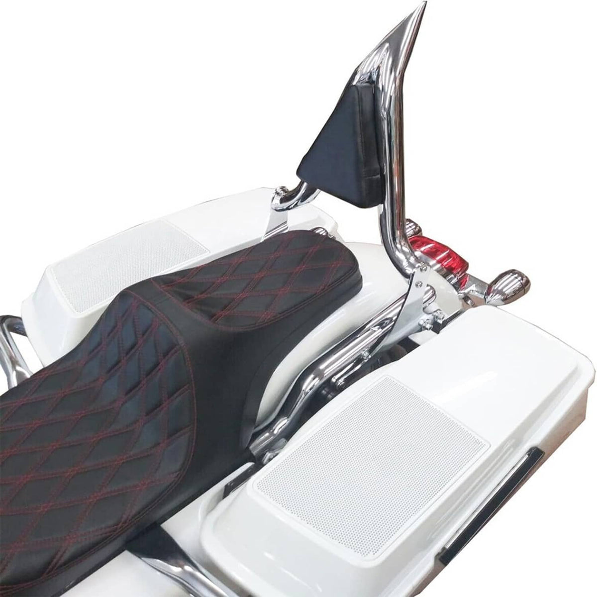 Chrome sissy bar backrest with black pad mounted behind a white motorcycle seat
