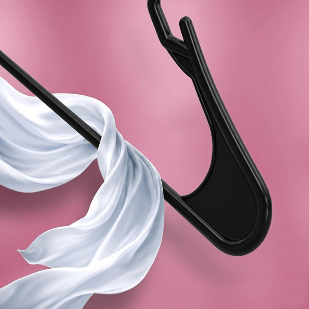 Close-up of a black plastic hanger hook with a hanging white garment sleeve.