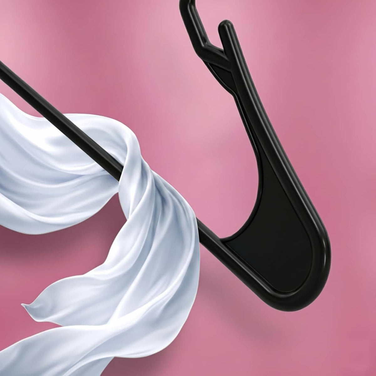 Close-up of a black plastic hanger hook with a hanging white garment sleeve.