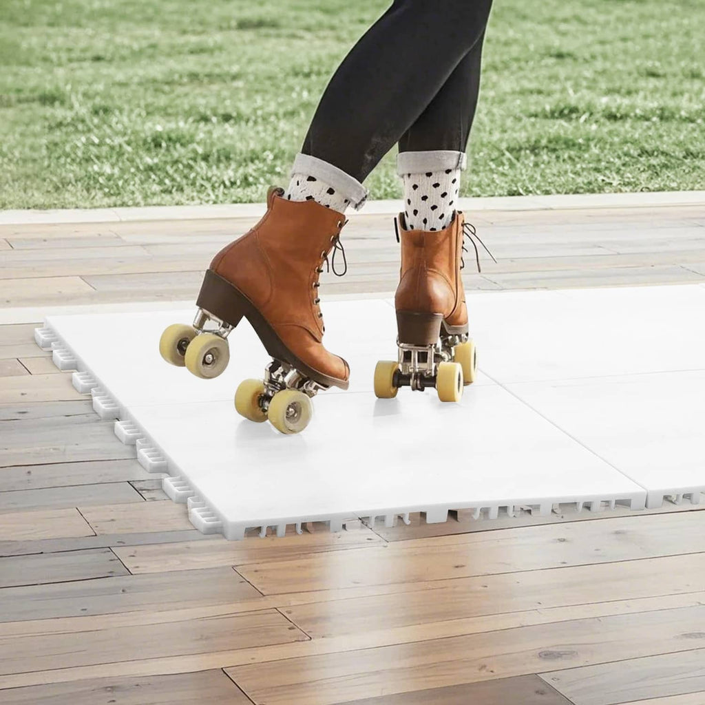 White interlocking exercise mat tiles with smooth surface on a wood floor