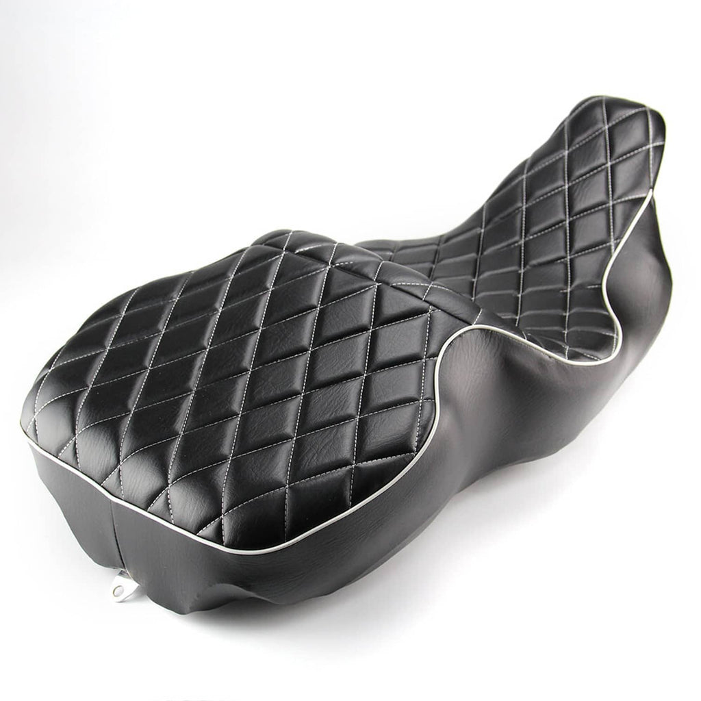 Black motorcycle rider seat with diamond quilt stitching and white piping, rear angle
