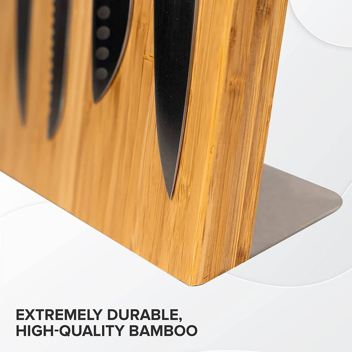 Coninx bamboo magnetic knife holder, close-up of angled slots and knife blades