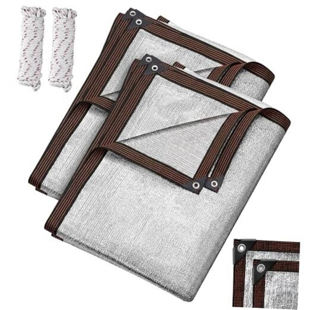 Reflective aluminum shade cloth set with brown trim and grommets, folded for storage
