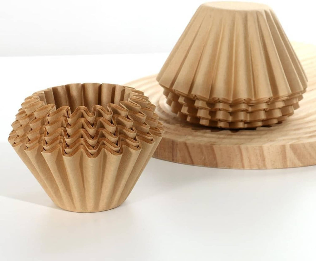 Natural cone coffee filter baskets, pleated paper cups on wooden tray