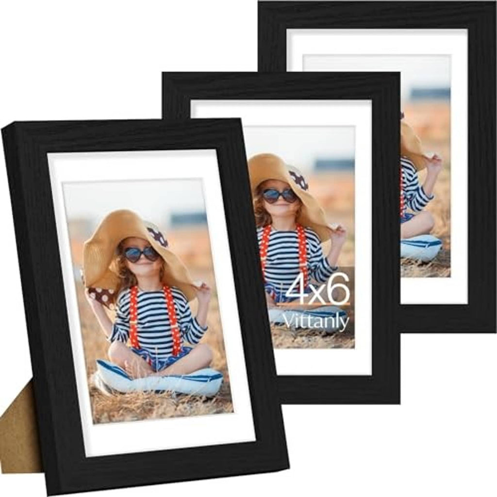 Set of 3 black picture frames with white mats and portrait photo inserts, angled overlap