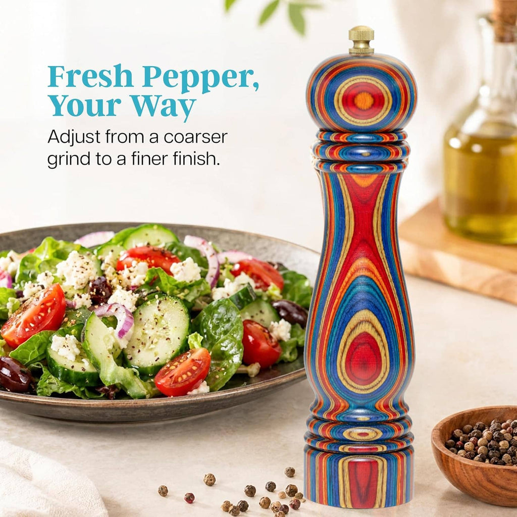 Tall colorful wooden pepper mill with brass top and stacked spiral rings